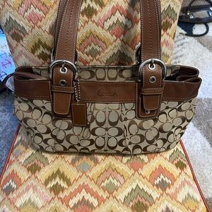 Coach - medium sized tan with brown leather bag serial No: F0932-F13742